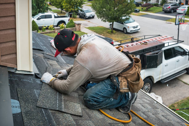 Professional Roof Repair technician working in Marion, NY
